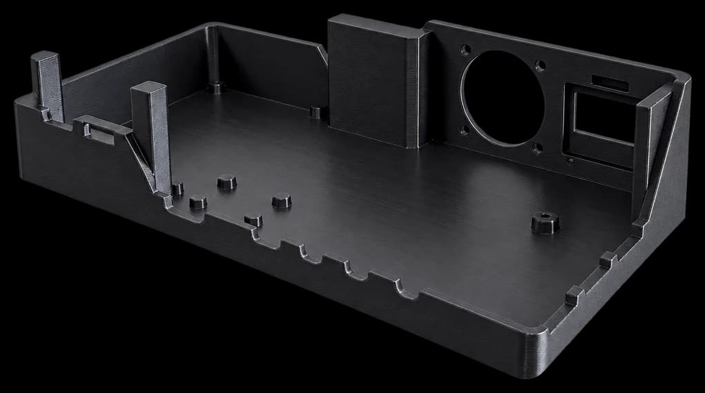 Black printed electronics enclosure with port cutouts and a fan opening